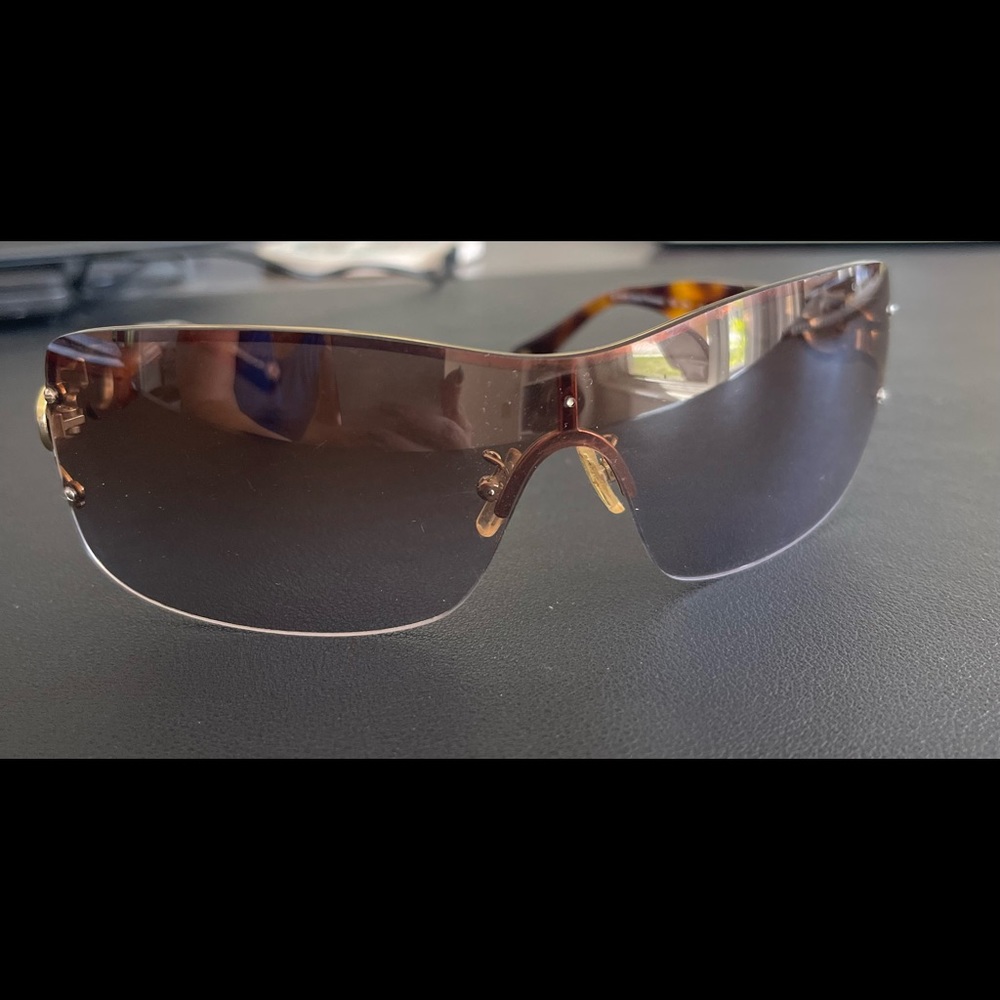 Brown and gold shield Coach sunglasses